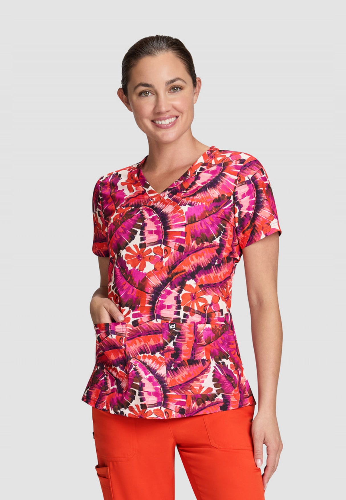 koi™ Next Gen Women's Early Energy 2-Pocket Scrub Print Top - Tropical Dreams