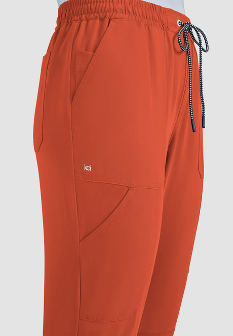 koi™ Next Gen Women's 7-Pocket Good Vibe Jogger - Burnt Umber