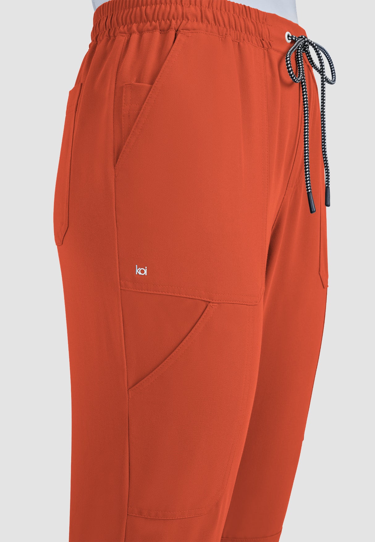 koi™ Next Gen Women's 7-Pocket Good Vibe Jogger - Burnt Umber