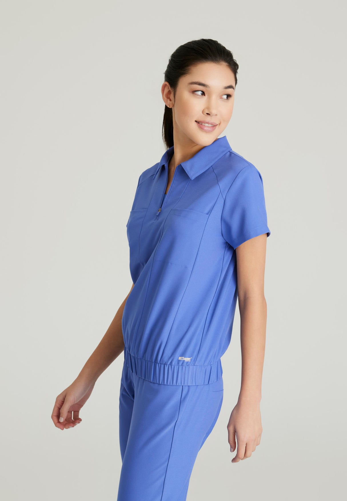 Grey's Anatomy™ Evolve Women's Perseverance 2-Pocket Zip Neck Banded Waist CiCLO® Top